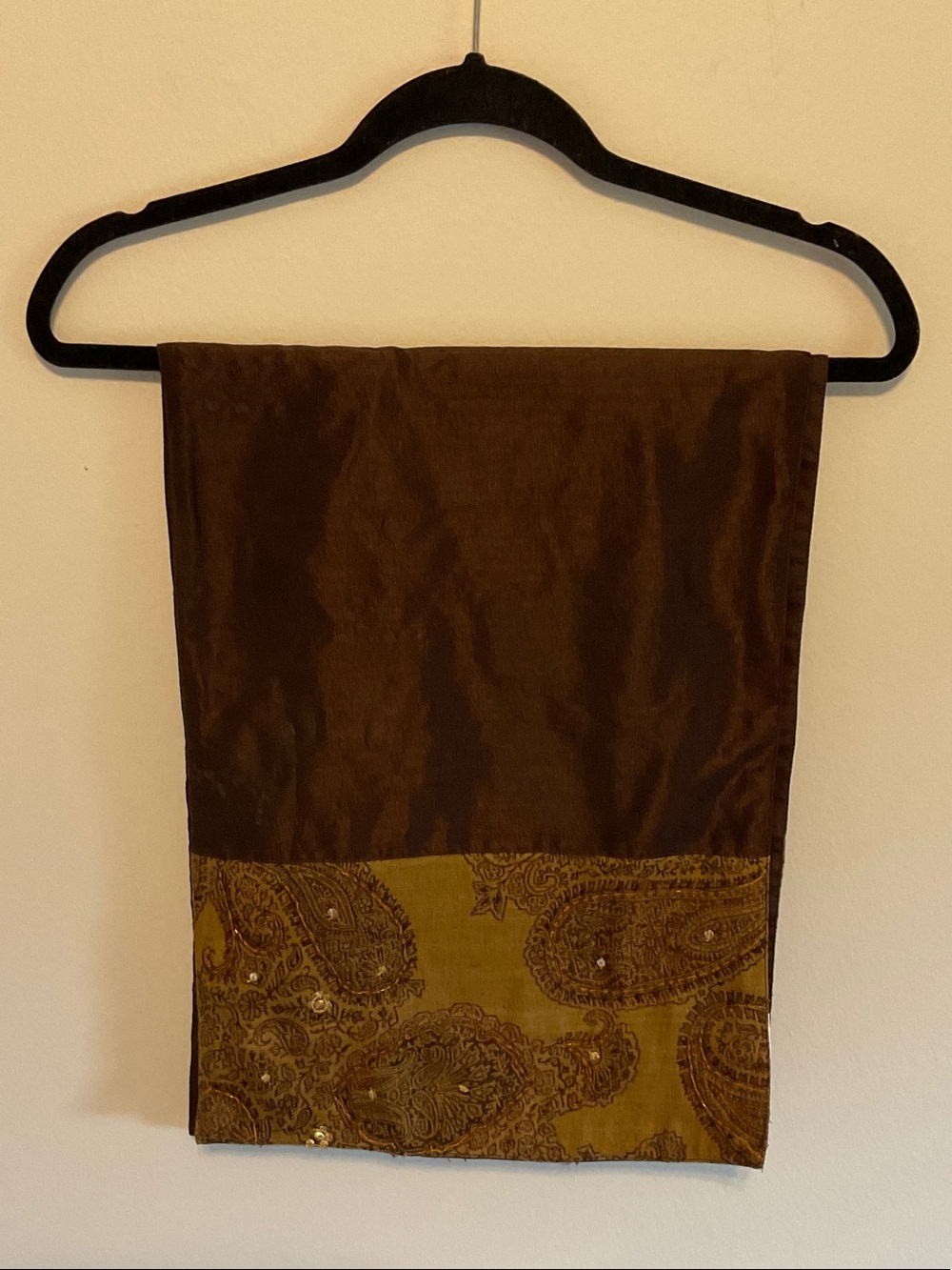 Brown table runner with Paisley bead ends. Runner is 72 inches long and 12.5 wid